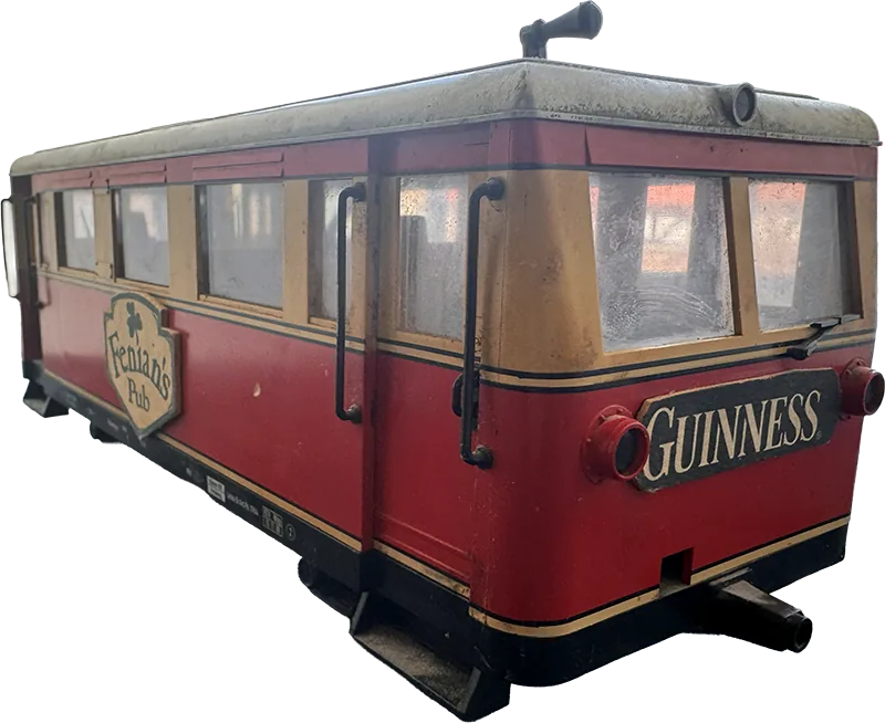 The Fenian's tram car in red and cream, a Guinness plate on its tail