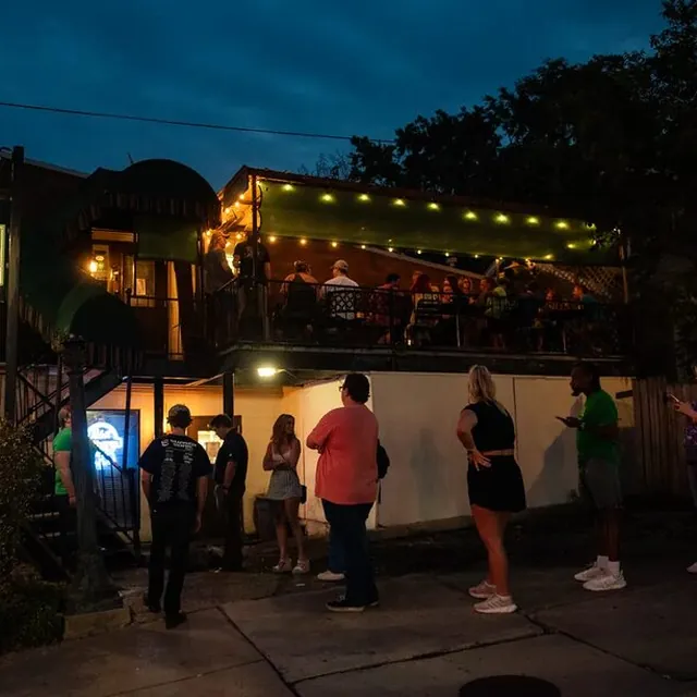 The deck under string lights at dusk